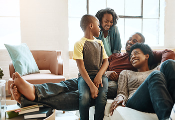 Image showing Black family children, happy parents or relax African people smile together, bond and enjoy quality time. Happiness, love and young youth kids, easy father and mother lounge on home living room sofa