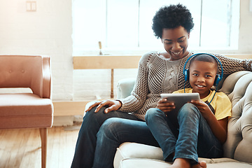 Image showing Mother, child and tablet for watching entertainment, movie or elearning on living room sofa together at home. Happy black mom relaxing with son on couch with touchscreen enjoying wifi, games or music