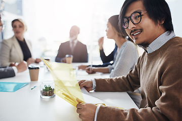 Image showing Portrait, business and Asian man in meeting, conversation and corporate success in modern office, planning and strategy. Male employee, financial adviser or team talking, budget and accounting folder