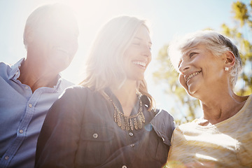 Image showing Woman, elderly parents and garden for sunshine lens flare, bonding or relax together in summer. Happy family, mother and daughter with senior man for love, care or outdoor at park, nature or backyard