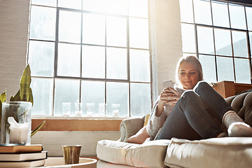 Image showing Woman with smartphone, social media and relax, communication and technology while chilling on sofa at home. Phone, typing online and connectivity, chat on mobile app with wifi in apartment