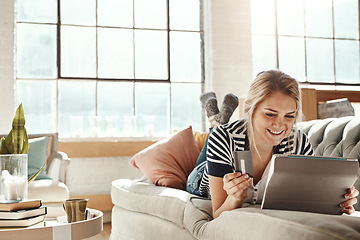 Image showing Tablet, ecommerce and payment of girl with credit card on sofa for banking details on card. Relaxed woman on home couch with happy and satisfied smile for online shopping purchase transaction