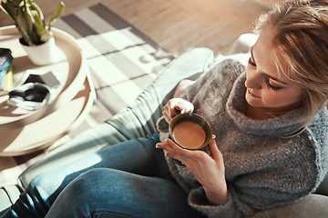 Image showing Woman, coffee and calm on sofa in living room for peace and relaxing quality time. Female, drinking warm tea and thinking for lifestyle wellness vision, morning routine and rest on couch in home