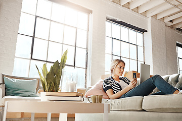 Image showing Thinking, laptop and credit card ecommerce woman on living room sofa for banking information payment check. Relaxed girl on home couch with concentration and focus for online shopping transaction.