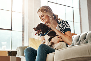 Image showing Woman, dog and calm smile on sofa in living room for animal care, love and support in home. Young female, pet care and relax peace on couch, playful and happiness lifestyle together with therapy dog