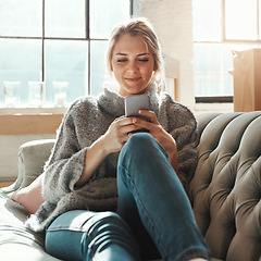 Image showing Woman, sofa and smartphone on social media, reading or communication on internet to relax in lounge. Girl, couch and chat with phone, mobile tech or online dating for partner, love or romance in home