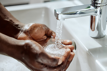 Image showing Black man, house bathroom or washing hands with water for healthcare wellness, hygiene maintenance or home self care. Zoom, wet or sink tap for cleaning, skincare grooming or bacteria safety routine