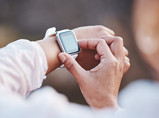 Image showing Hands, smartwatch and fitness with woman and monitor steps or heart with runner, exercise outdoor with cardio. Training, workout and check progress with technology, running with smart watch zoom