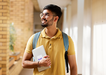 Image showing University student, college and indian man with a tablet and backpack while walking down campus corridor. Young gen z male happy about education, learning and future after studying at school building