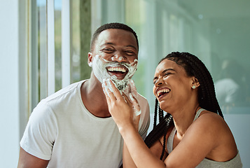 Image showing Skincare wellness, happy couple in bathroom and shaving face with product for facial treatment. Laughing together in home, natural beauty and funny girlfriend helping black man with cream application