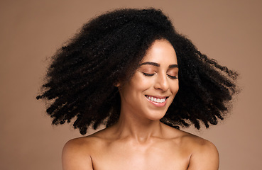 Image showing Shake hair, afro and face of black woman with clean shampoo hair care, luxury skincare cosmetics and natural facial makeup. Spa salon, trichology and happy African model with aesthetic healthy hair