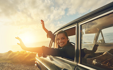 Image showing Car, woman and road trip to the beach, vacation and summer break, travelling and happiness. Young female smile, girl and vehicle for seaside holiday, fun and freedom with sunset, journey or adventure