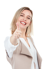 Image showing Happy, thumbs up and portrait of woman in studio with positive agreement, winner or success gesture. Happiness of young person in isolated white background with smile for ok or approval of people.