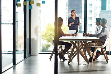 Image showing Presentation, meeting and business people in office building for planning, marketing strategy and goals. Leadership, teamwork and woman speaking to workers for our vision, target and ideas at desk