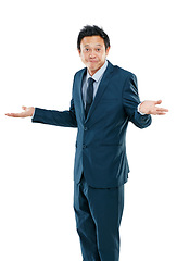 Image showing Businessman from Japan, confused and hands out isolated with questions and asking on white background. Confusion, doubt and person with suit, problem and frustrated hand gesture in studio portrait.