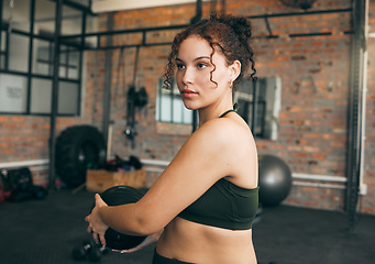 Image showing Exercise, medicine ball and a strong woman at gym for a workout, fitness training and body wellness. Sports female or athlete with focus during weight twist routine for power, core balance and energy