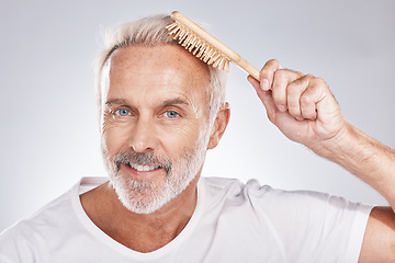 Image showing Portrait man brush hair on studio background for beauty, barber salon and cosmetics. Happy face, male model and hairstyle comb for self care of smooth hair care, healthy shampoo and scalp product