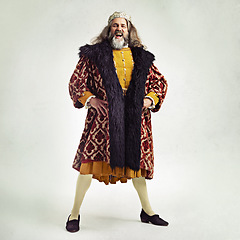 Image showing King, crown and portrait with a royal man in studio on a gray background during the renaissance period of history. Medieval, victorian and royalty with a male ruler posing as leader of his kingdom