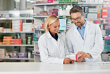 Image showing Pharmacy, medicine and pharmacist people for stock check, reading label and healthcare inventory. Product shelf, pills or tablet box and medical expert advice to retail worker, teamwork and help desk