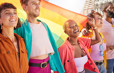 Image showing Friends, city and lgbt people walking with rainbow flag for support, queer celebration and parade for solidarity. Diversity, lgbtq community and group enjoy freedom, happiness and pride identity