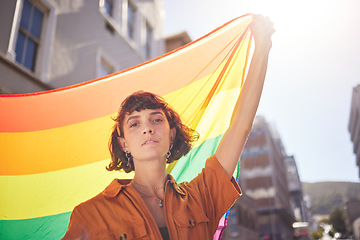 Image showing Portrait, pride and woman in city with flag for lgbtq community, ally or lesbian with support and equality in love outdoor. Rainbow, parade and lgbt awareness, inclusion and celebrate with sexuality