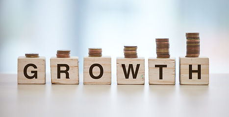 Image showing Money, finance growth and coin on blocks for increase in savings, budget and investment for economy. Financial planning, success and cash stack for growing salary, banking account and stock market