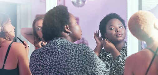 Image showing Black woman, night out and girls in bathroom, ready for party and evening out for dancing, bonding and fun. Ladies, females and friends fixing hair, makeup and outfit for club, beauty and happiness