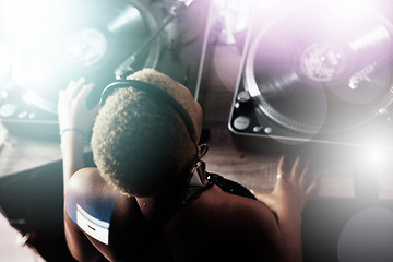 Image showing Black woman, DJ and music for party, club or event in celebration, sound or energy with technology. African American female musician with turntable for disco, concert or audio track at nightclub