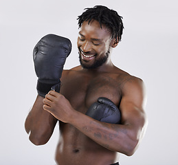 Image showing Boxing, fitness and black man happy about fight for sport training and workout in studio. Athlete boxer gloves for exercise, performance and mma competition with power and energy for motivation