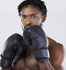 Image showing Boxing gloves, strong man and fitness portrait to fight for sports training and workout in studio. Athlete boxer person ready for exercise, performance and mma competition with power and energy
