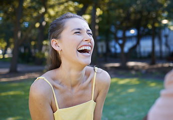 Image showing Happiness, young woman and casual in park, summer and joyful with trendy outfit, laughing and chilling. Happy female, lady and smile outdoor, funny and fashion for comfort, freedom or carefree moment