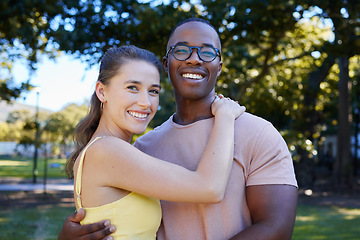 Image showing Interracial, portrait and couple hug, park or smile for relationship, romance or bonding. Love, black man or woman romantic in nature, loving or happiness with embrace, dating or quality time outdoor