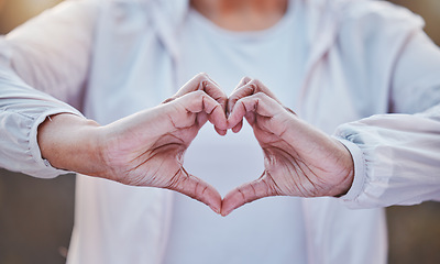 Image showing Heart, fitness and senior hands with health in cardio, sports or training with wellness love, hope and health background. Support, healthcare and retirement love sign of woman in exercise or workout