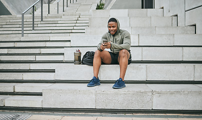 Image showing Social media, phone or black man on steps after fitness training, exercise or workout with a sports bag in Miami, Florida. Social networking, happy or healthy athlete texting, chat or typing online