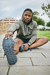 Image showing Fitness, park or black man stretching in exercise for body training or workout with focus in Detroit, USA. Legs, mindset or healthy sports athlete with running goals, motivation or mission in city