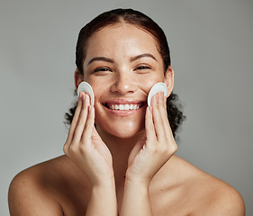 Image showing Skincare, beauty and portrait of a woman with cotton for face acne, cosmetic cleaning and dermatology glow on a studio background. Cosmetics, happy and model with clean pads for facial wellness