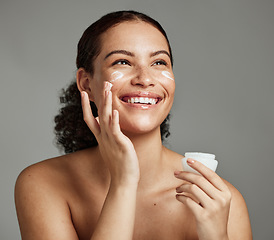 Image showing Black woman, smile and face beauty cream for skincare wellness shine, cosmetics dermatology and salon spa product in studio. African girl, spf lotion and self care happiness for luxury facial glow