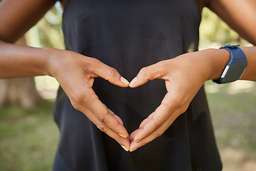 Image showing Hands, heart sign and fitness with a yoga black woman outdoor for meditation, mental health or wellness. Nature, peace and park with a female athlete meditating outside for loving peace or balance