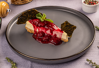 Image showing Berries cheescake with red icing