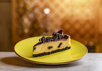 Image showing Creamy cheesecake with chocolate cookies