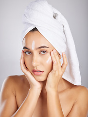 Image showing Skincare, woman model and face portrait with facial moisturizer and spa cream in morning. Towel, sunscreen and skin wellness care of a young person with cosmetic, collagen and dermatology product