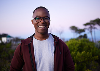 Image showing Happy, smiling and portrait of a black man in nature for fun, relaxation and walking in Turkey. Smile, peace and calm African person in a park for an environment walk, adventure and zen during sunset