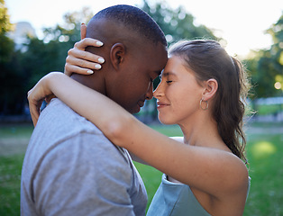 Image showing Love, forehead and interracial couple, outdoor and quality time for bonding, romantic and loving together. Romance, black man and woman hug, embrace and relationship with intimate and facial contact