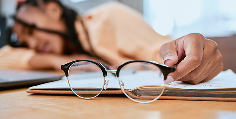 Image showing Black woman, glasses and sleeping in home office with a book while studying or working with fatigue. Entrepreneur person tired, burnout and exhausted with remote work and startup business stress