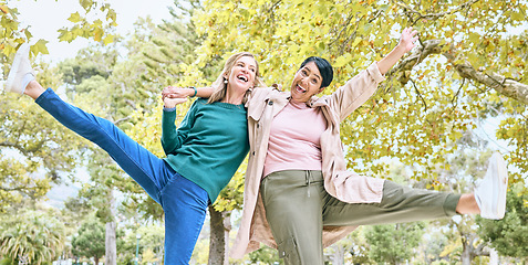 Image showing Dance, happy or senior friends in a park in celebration of a crazy, funny or relaxing holiday vacation in summer. Wellness, old woman or elderly women hugging, bonding or dancing playfuly in nature