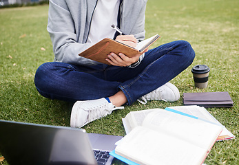 Image showing Study, laptop and student in park writing at university, college or campus for education research, planning schedule or scholarship. Relax person on grass learning on technology and notebook for exam