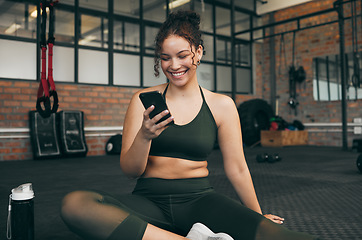 Image showing Happy woman, fitness and phone at gym for a workout, training and body wellness with a mobile app. Sports female with smartphone for progress, performance and communication for a healthy lifestyle