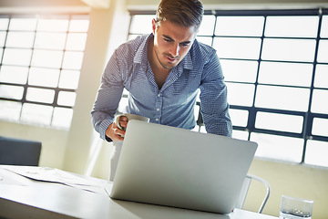 Image showing Business man, laptop and information technology with system upgrade, coding at desk and internet . Corporate IT employee, ux with software development and connectivity, wifi and tech with programming