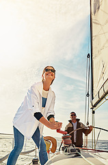 Image showing Happy couple, boat and steering helm in sea travel, holiday investment and retirement wealth hobby. Rich, fun and sailing of mature people on ocean or lake water for outdoor adventure and activity