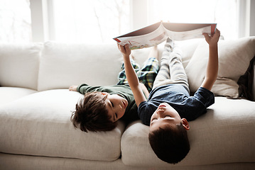 Image showing Reading, learning and children with books on the sofa for knowledge, information and education. Relax, content and boys with a story for happiness, studying and playing on the living room couch